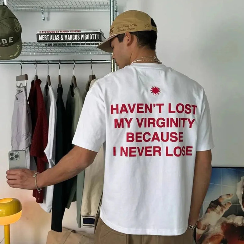 Funny Men’s White Graphic T-Shirt – “Haven’t Lost My Virginity Because I Never Lose” Statement Tee | physical by Acid House™ (formerly Zyra Drip)