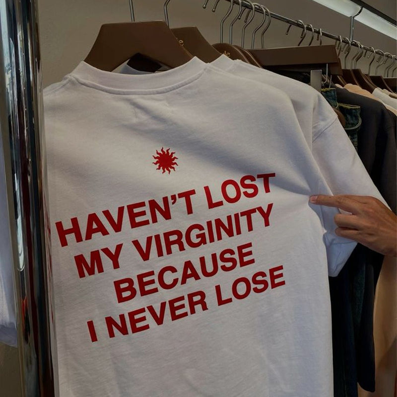Funny Men’s White Graphic T-Shirt – “Haven’t Lost My Virginity Because I Never Lose” Statement Tee | physical by Acid House™ (formerly Zyra Drip)