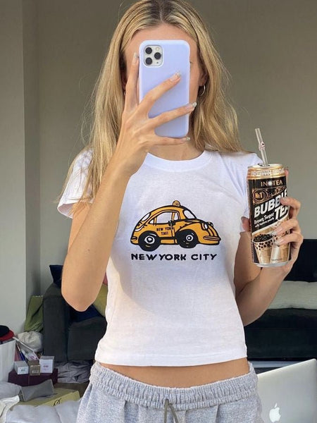 NYC Taxi Baby Tee | White New York City Graphic Crop Top - Y2K Aesthetic Tee for Women | physical by Acid House™ (formerly Zyra Drip)