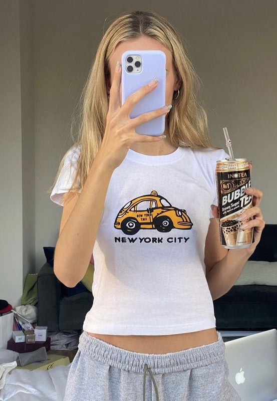 NYC Taxi Baby Tee | White New York City Graphic Crop Top - Y2K Aesthetic Tee for Women | physical by Acid House™ (formerly Zyra Drip)